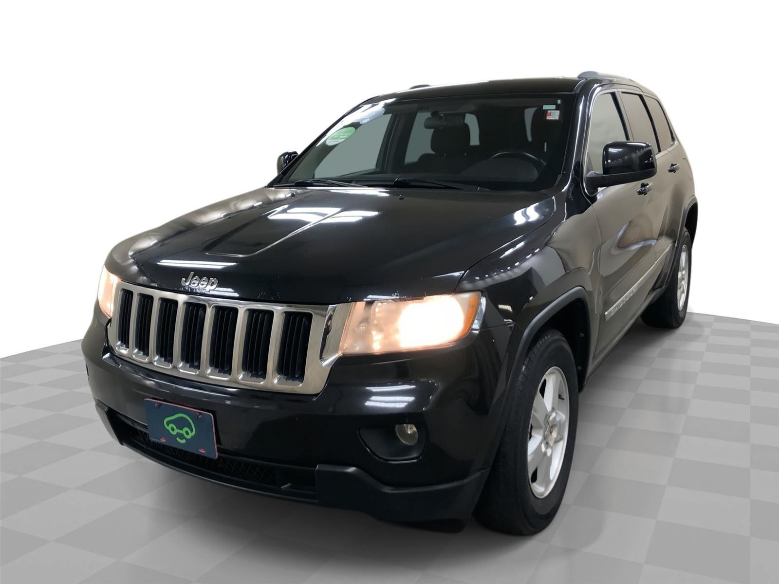 2012 Jeep Grand Cherokee Laredo in Black — front three-quarter view