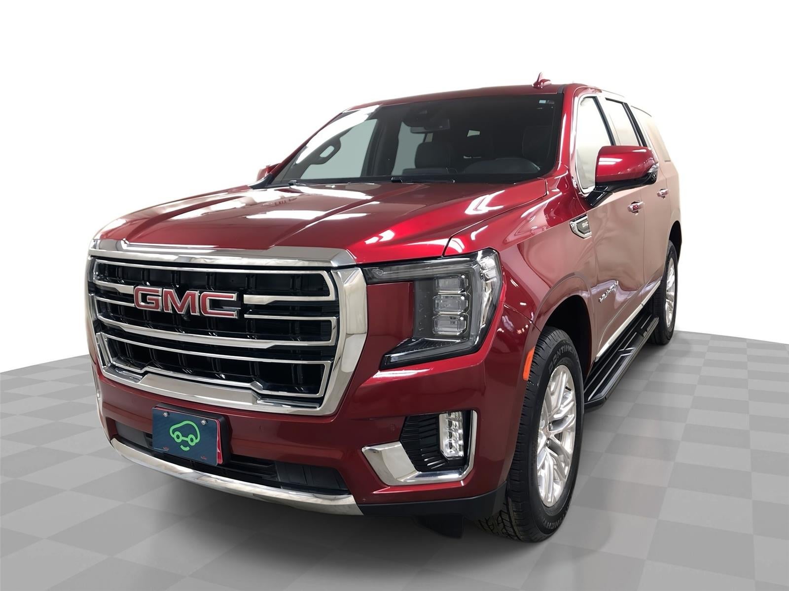 2024 GMC Yukon SLT in Volcanic Red Tintcoat — front three-quarter view