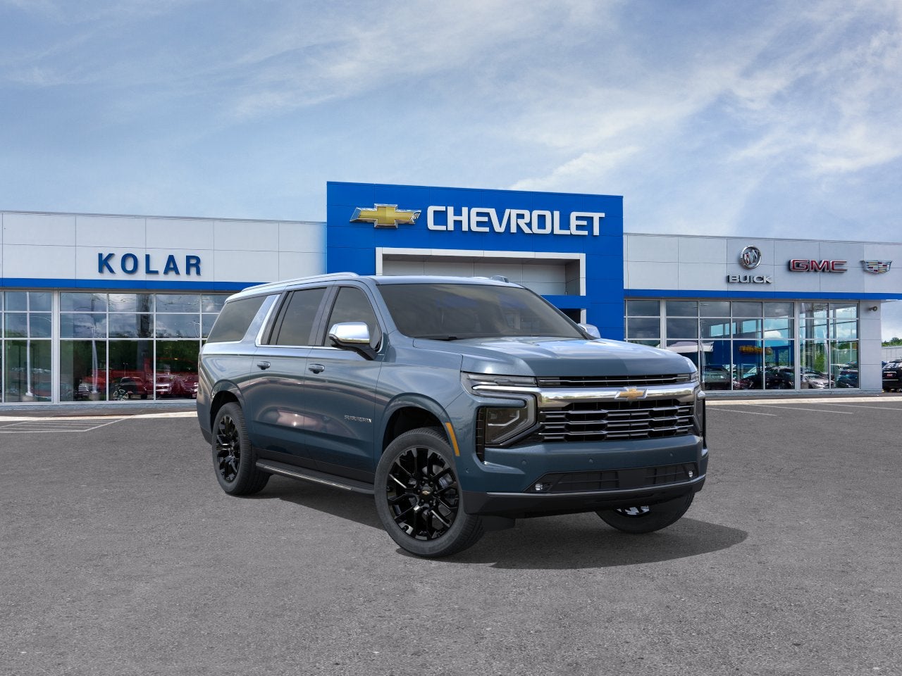 2026 Chevrolet Suburban Premier in Lakeshore Blue Metallic — front three-quarter view