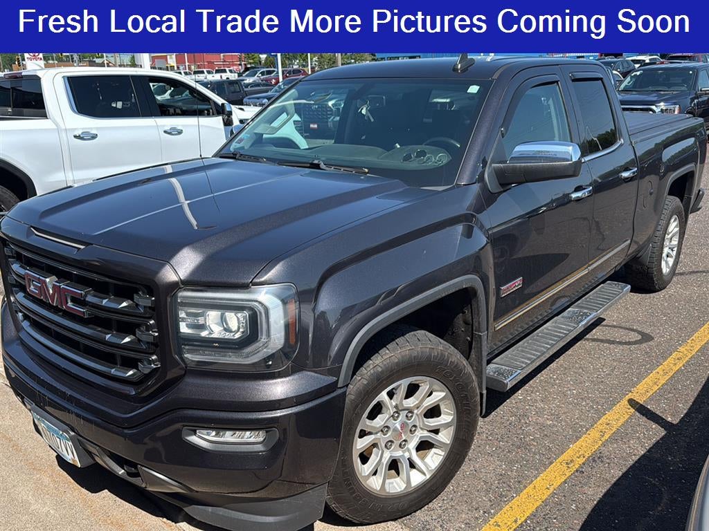 2016 GMC Sierra 1500 SLT in Iridium Metallic — front three-quarter view